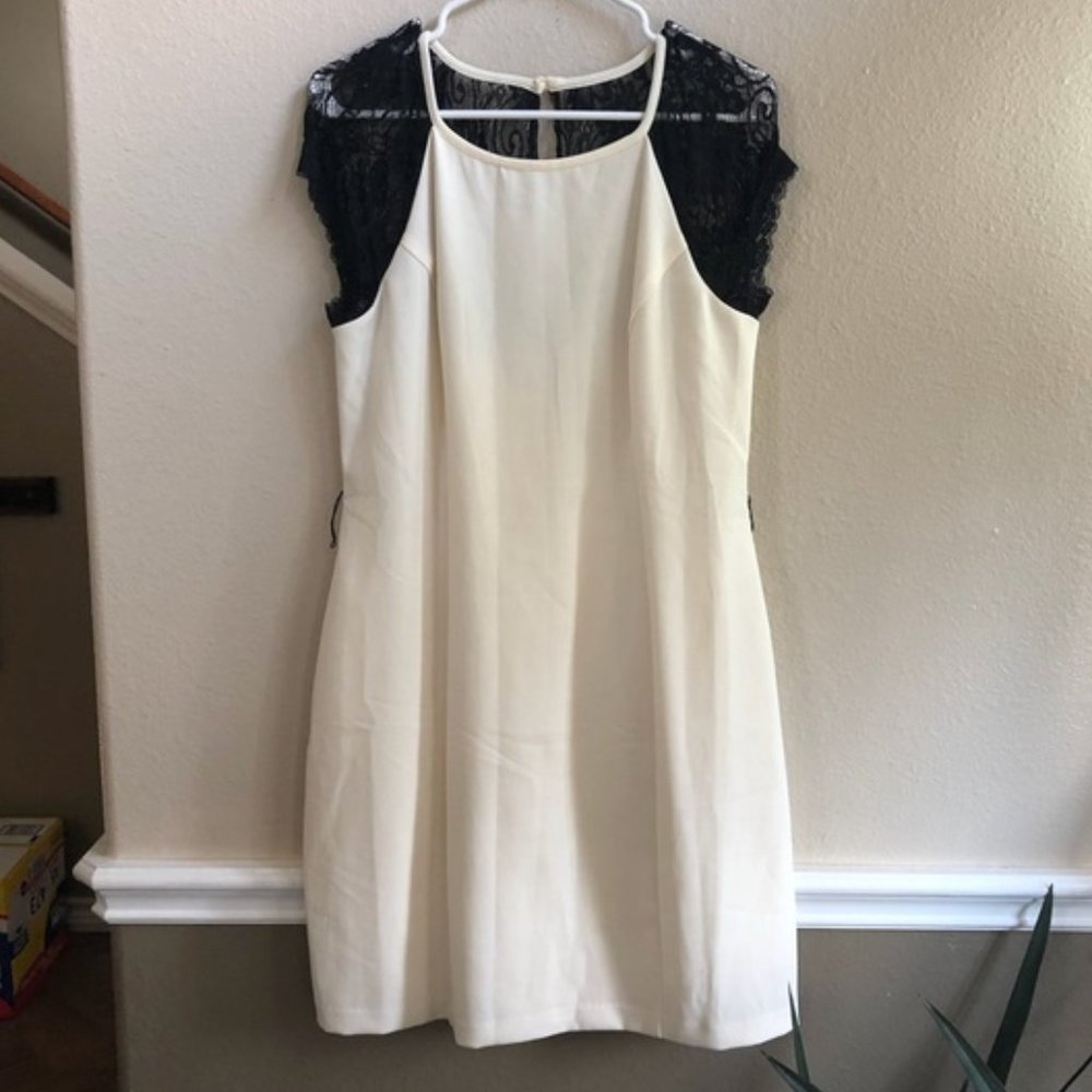 Bisou Bisou cream dress with black lace sleeves